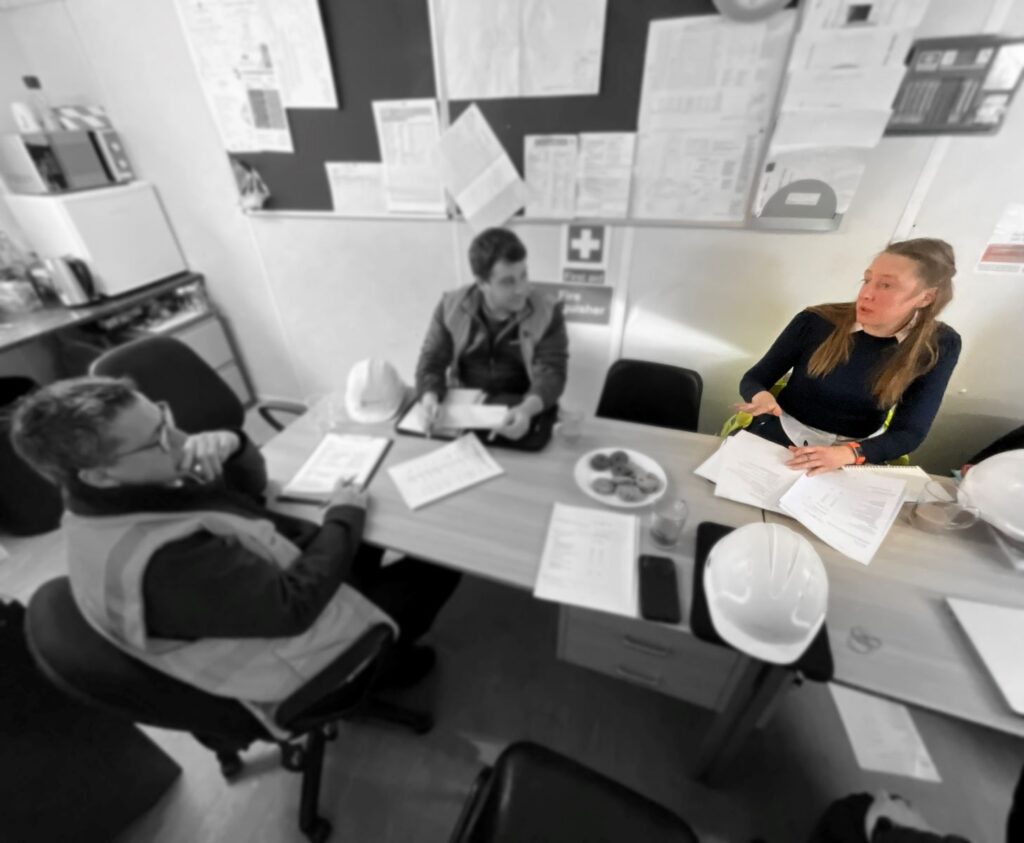 Hannah Clayton chairing a project progress meeting with clients and contractors
