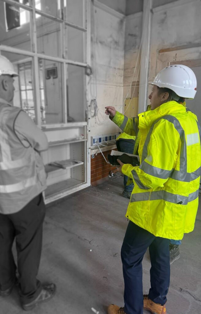 Hannah Clayton visiting a construction site during project delivery