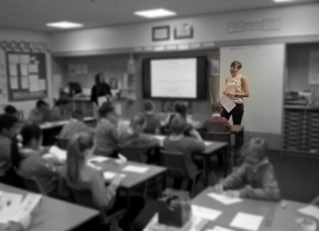 Hannah Clayton delivering an architecture workshop in a primary school classroom