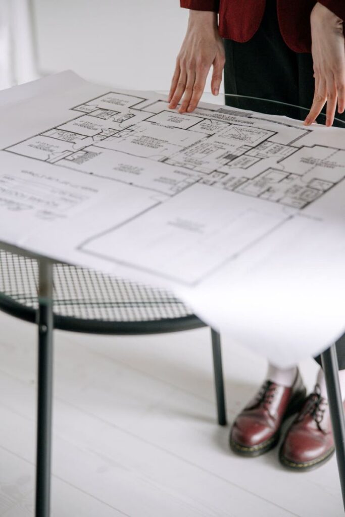 Architect reviewing blueprints